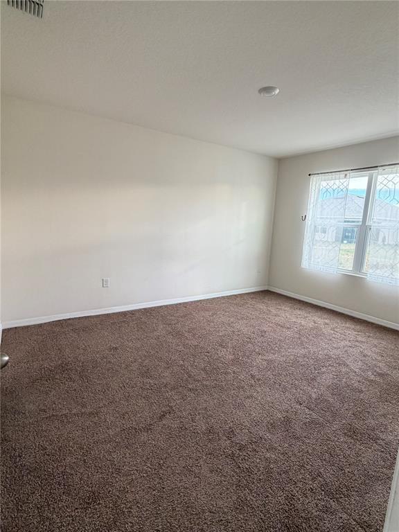 569 Talisi Loop St. Cloud, FL 34771 - Photo 12 of 20 an empty room with windows