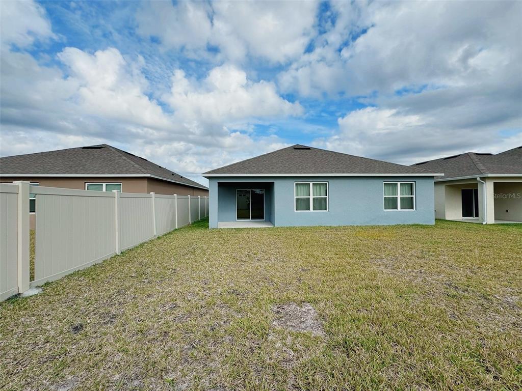 569 Talisi Loop St. Cloud, FL 34771 - Photo 20 of 20 a house with yard in front of it
