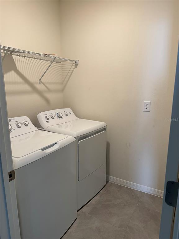 569 Talisi Loop St. Cloud, FL 34771 - Photo 5 of 20 a utility room with dryer and washer