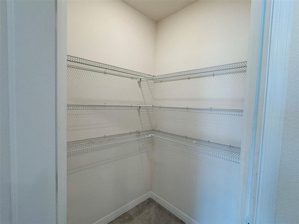 569 Talisi Loop St. Cloud, FL 34771 - Photo 8 of 20 a view of an empty walk in closet