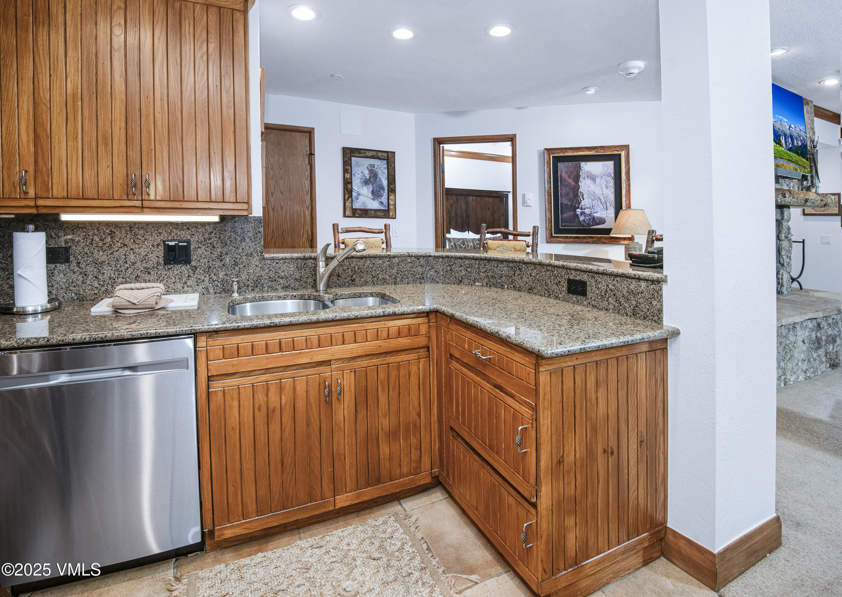 120 Offerson Road, Unit 6140 Beaver Creek, CO 81620 - Photo 13 of 38 a kitchen with stainless steel appliances granite countertop a sink stove and cabinets