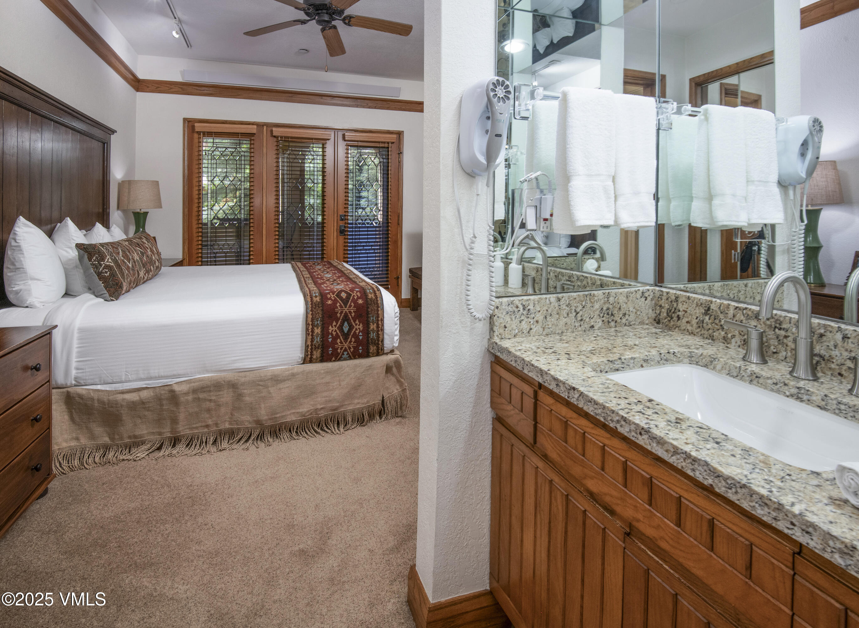 120 Offerson Road, Unit 6140 Beaver Creek, CO 81620 - Photo 18 of 38 a bathroom with a granite countertop sink and a mirror