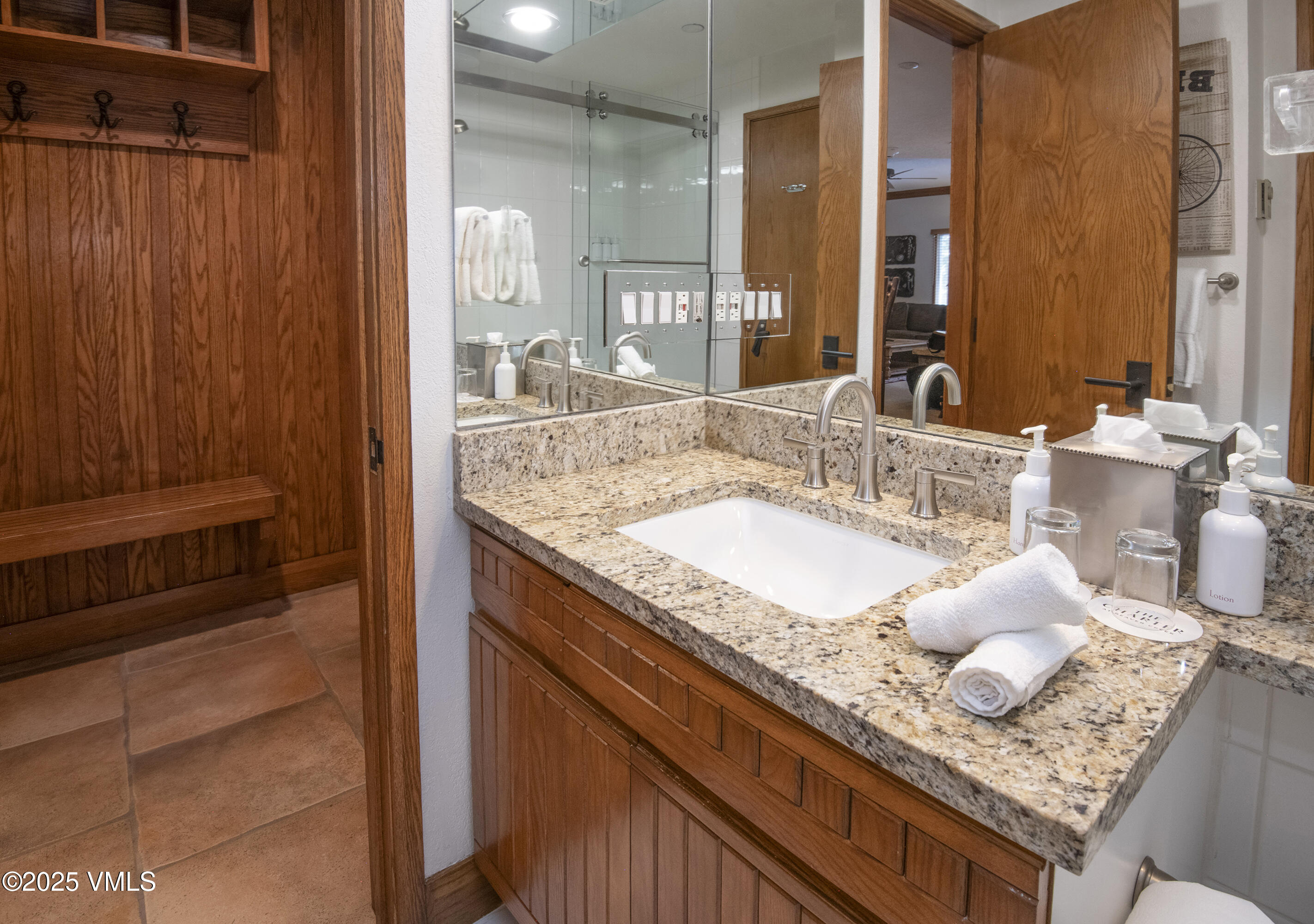 120 Offerson Road, Unit 6140 Beaver Creek, CO 81620 - Photo 22 of 38 a bathroom with a granite countertop sink and a mirror