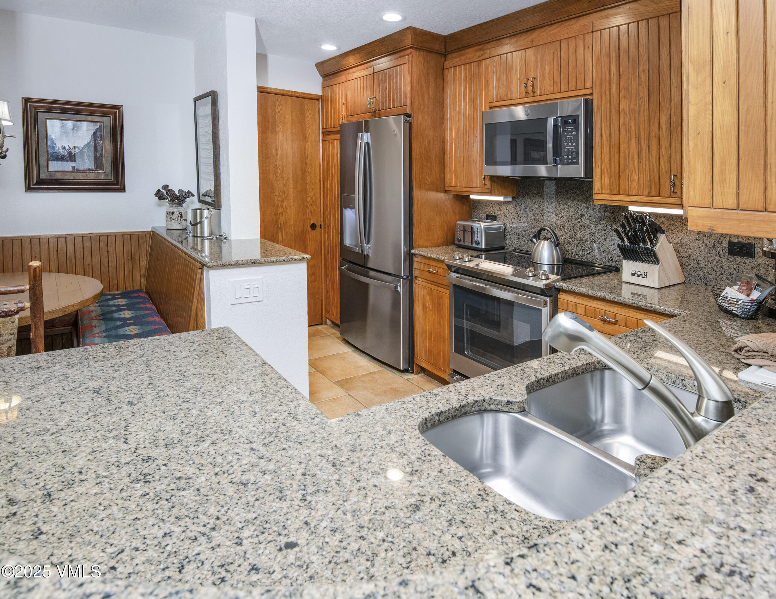 120 Offerson Road, Unit 6140 Beaver Creek, CO 81620 - Photo 4 of 38 a kitchen with stainless steel appliances granite countertop a sink stove and refrigerator
