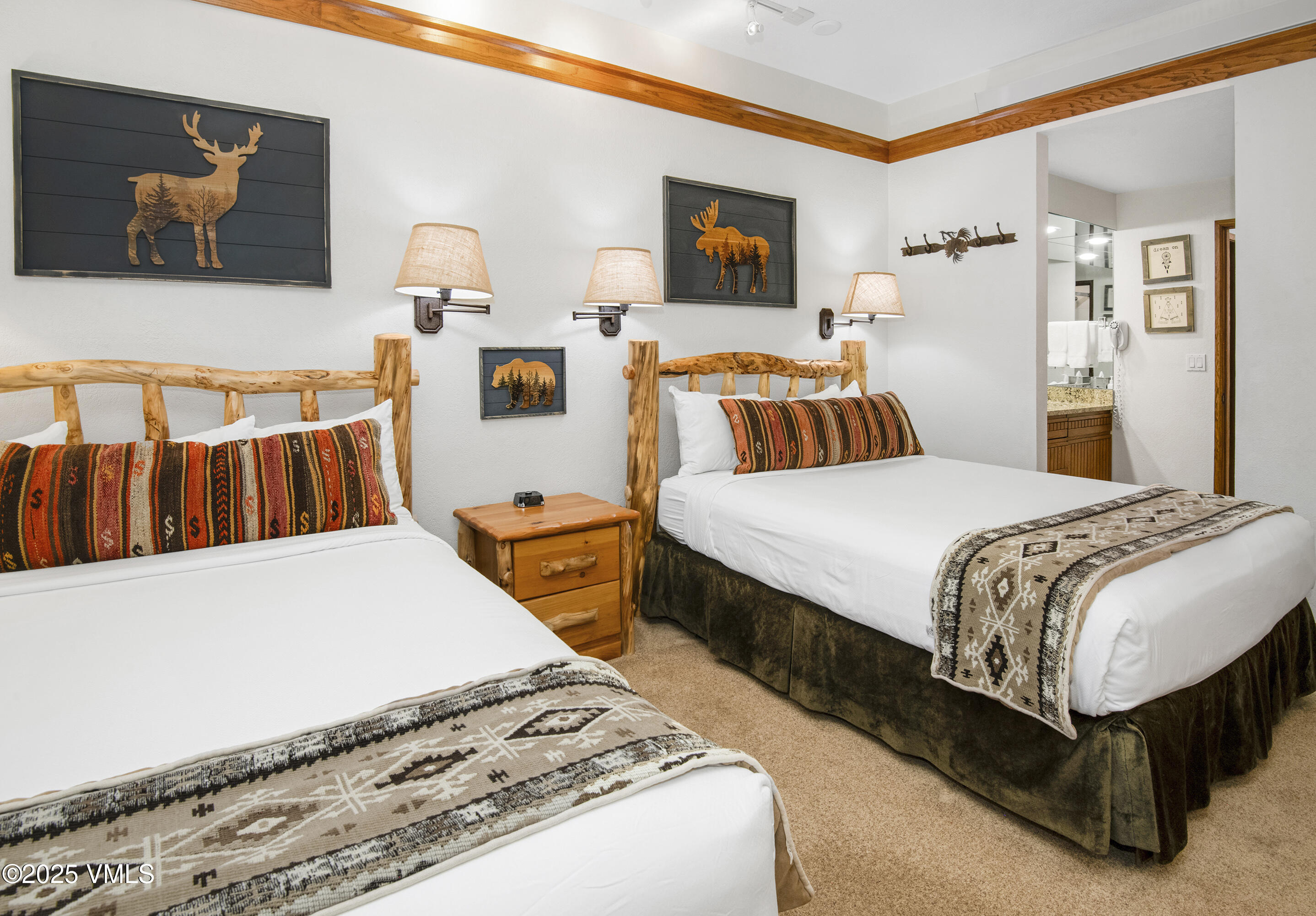 120 Offerson Road, Unit 6140 Beaver Creek, CO 81620 - Photo 5 of 38 a bedroom with a bed and wooden floor