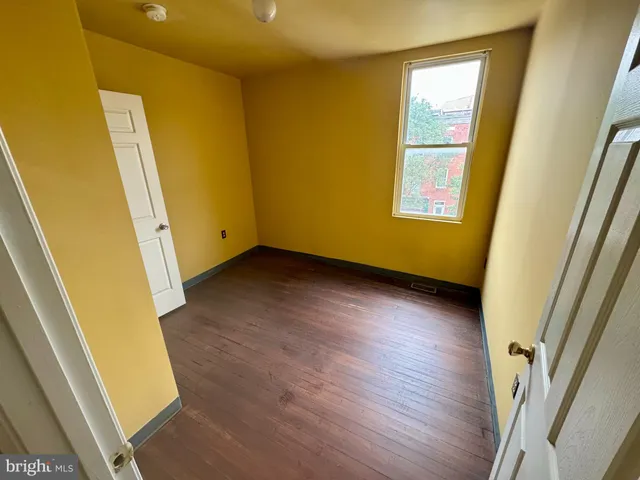 a view of an entryway with wooden floor