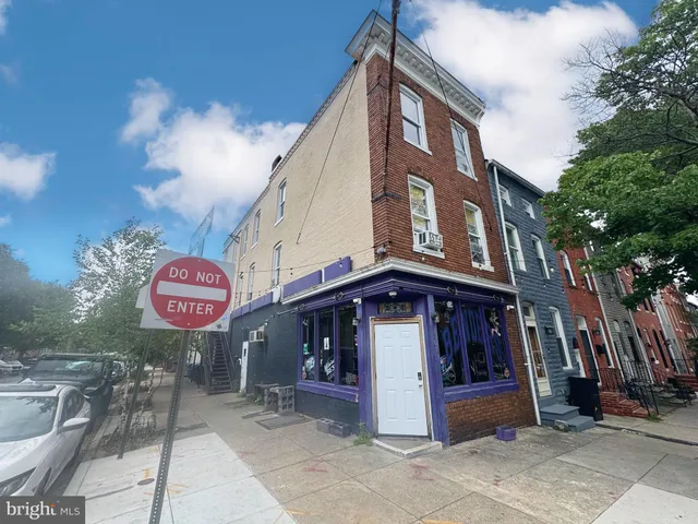 a view of a building with retail shops