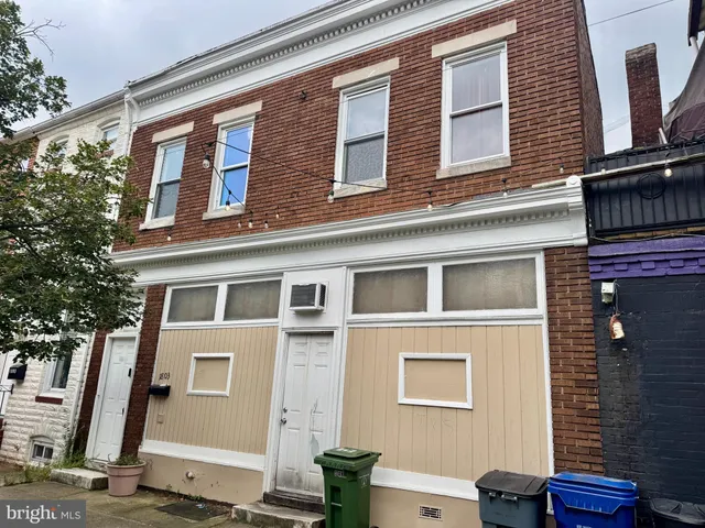 a front view of a building with many windows