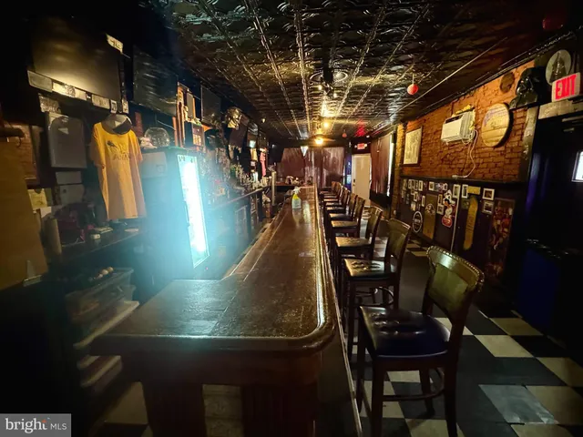 a living room filled with furniture and a flat screen tv