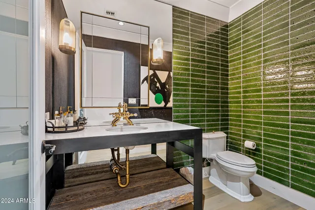 a bedroom with furniture and a chandelier