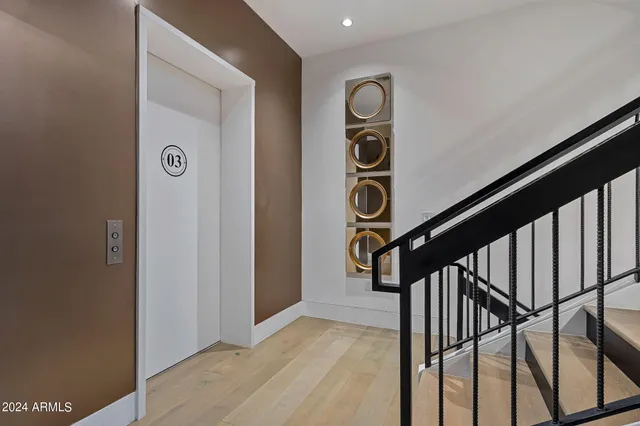 a bathroom with a granite countertop sink a toilet and a shower curtain