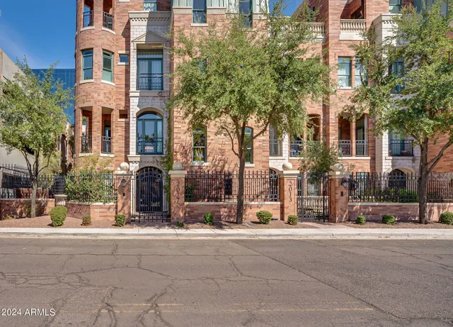 a living room with furniture a rug and a window