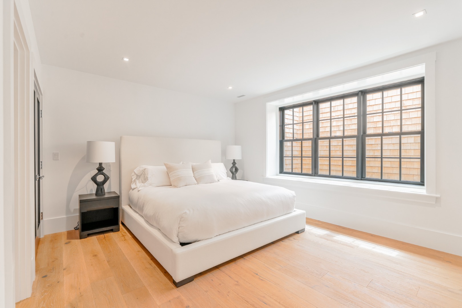12 Derrymore Road Nantucket, MA 02554 - Photo 35 of 35 a large bedroom with a bed and a large window