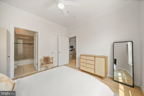 a bedroom with a bed and a dresser