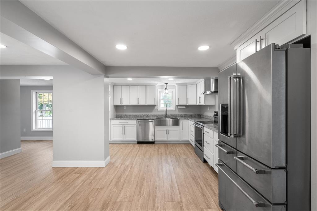 428 Weimer Road Leechburg, PA 15656 - Photo 11 of 42 a kitchen with kitchen island a counter top space a sink appliances and cabinets