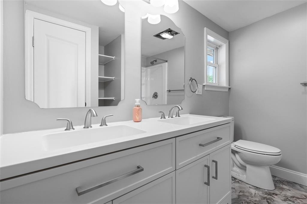 428 Weimer Road Leechburg, PA 15656 - Photo 27 of 42 a bathroom with a toilet sink and mirror