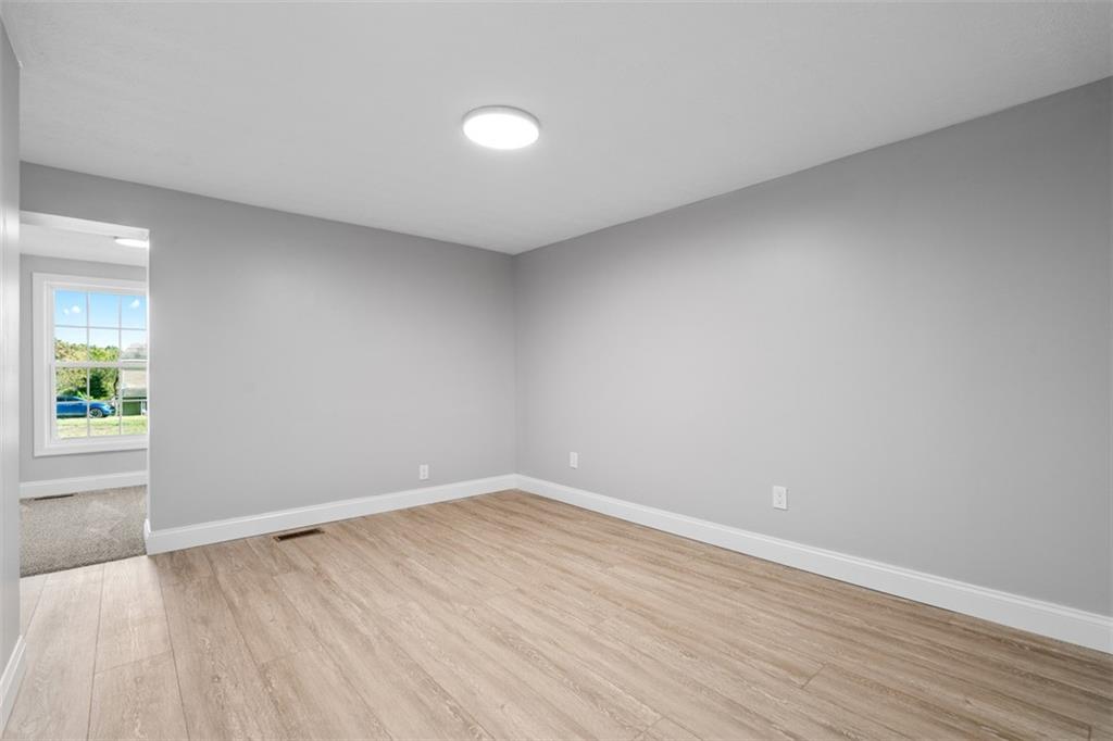 428 Weimer Road Leechburg, PA 15656 - Photo 29 of 42 an empty room with wooden floor and windows