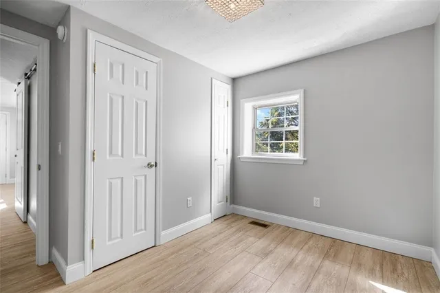 a bathroom with a sink mirror and toilet