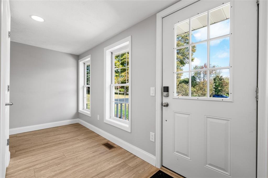 428 Weimer Road Leechburg, PA 15656 - Photo 7 of 42 a view of an empty room with wooden floor and a window