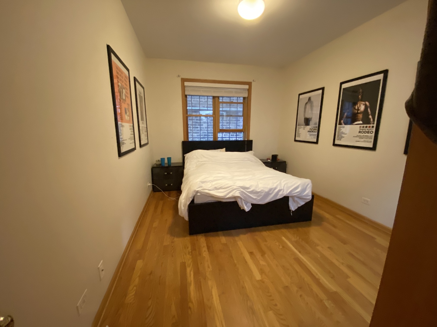 654 West Briar Place, Unit G Chicago, IL 60657 - Photo 12 of 17 a bedroom with a bed and a window