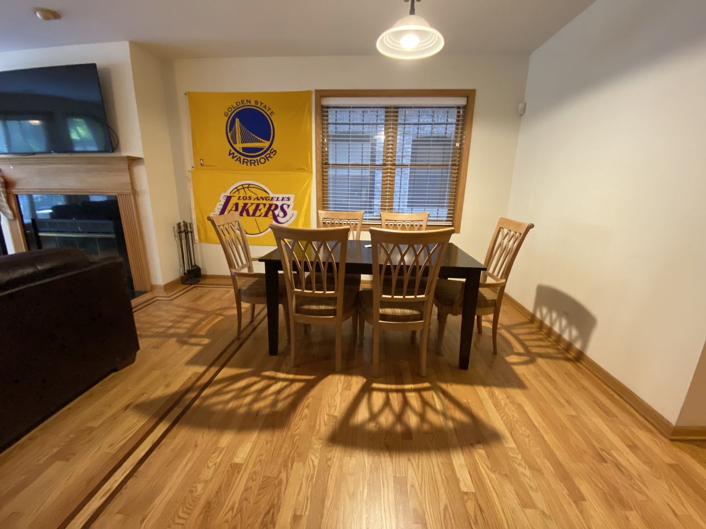 654 West Briar Place, Unit G Chicago, IL 60657 - Photo 5 of 17 a view of a dining room with furniture and wooden floor