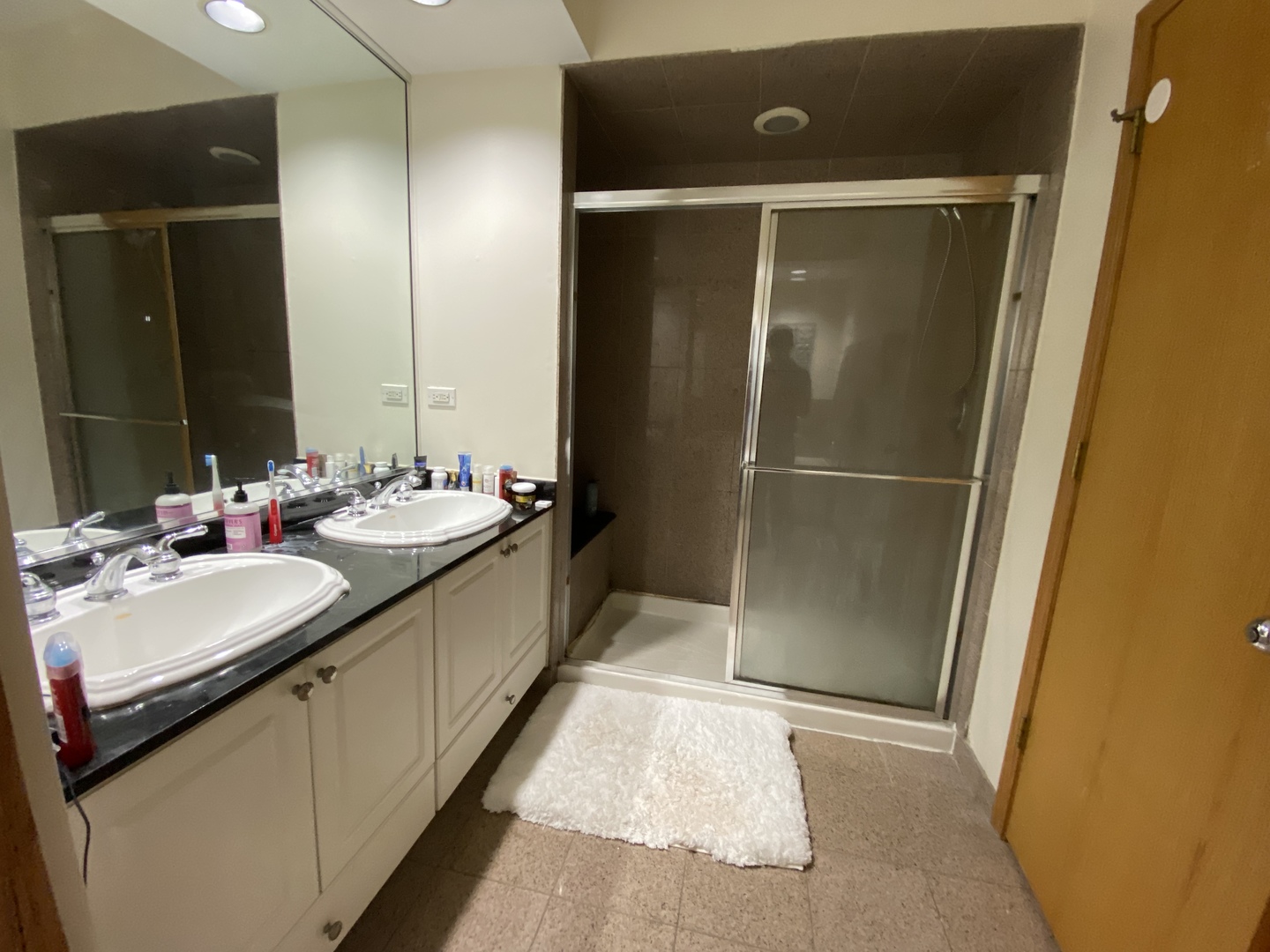 654 West Briar Place, Unit G Chicago, IL 60657 - Photo 10 of 17 a bathroom with a double vanity sink and mirror