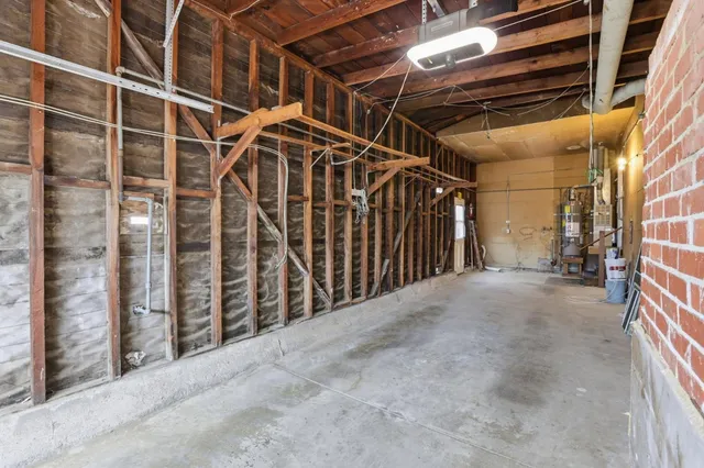 a view of an empty room with wooden walls