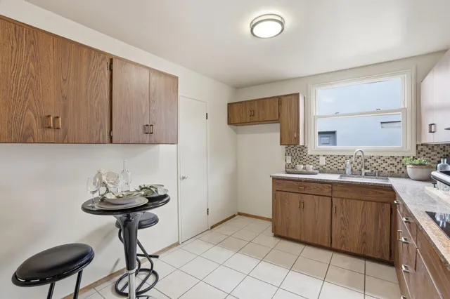 a kitchen with a sink and cabinets