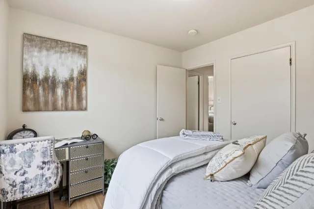 a bedroom with a bed and a furniture