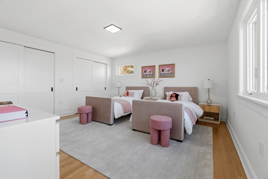 171 Shaw Road Brookline, MA 02467 - Photo 21 of 42 a bedroom with a bed and a window