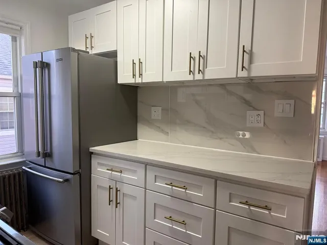 a kitchen with appliances and cabinets