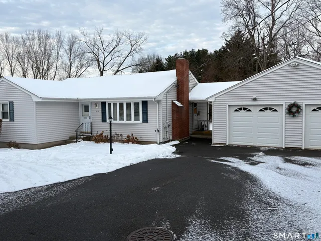 a backyard of a house with wooden fence