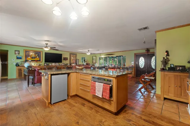 a living room with lots of furniture and a flat screen tv