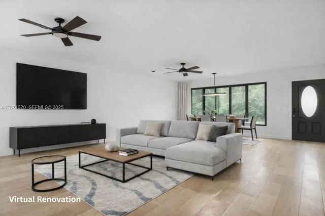 a living room with lots of furniture and a flat screen tv