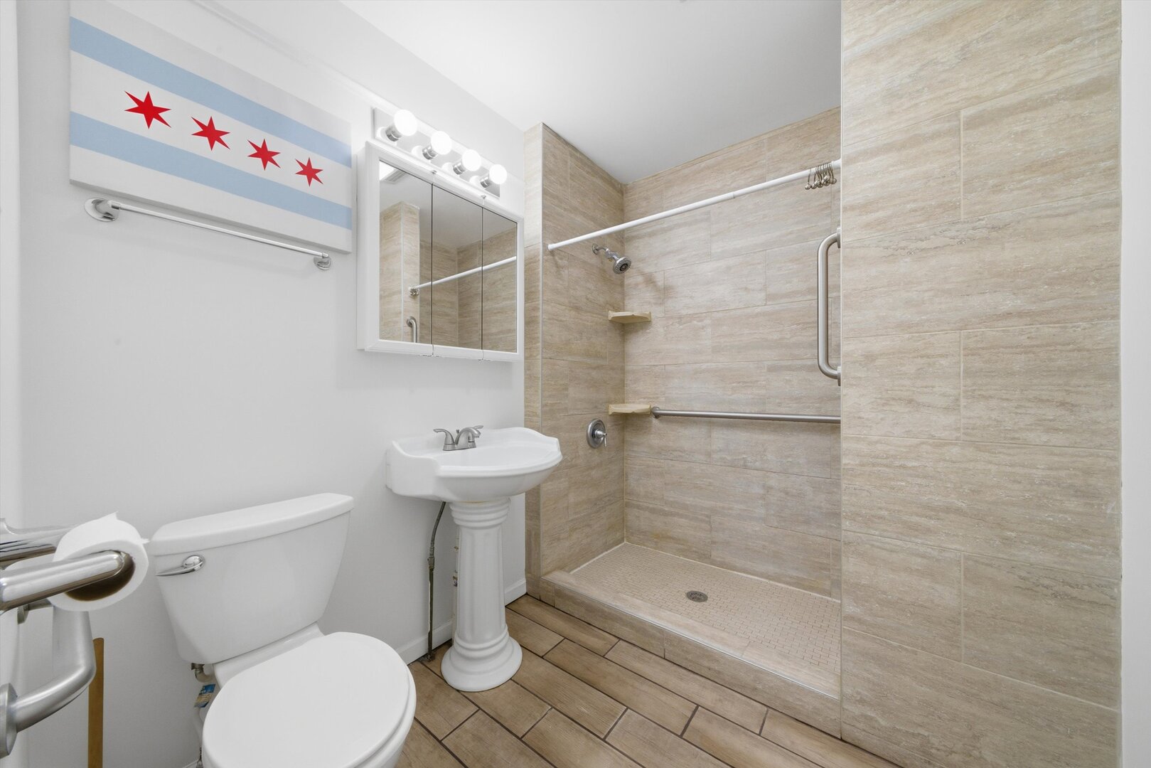2125 West 18th Place, Unit 5 Chicago, IL 60608 - Photo 11 of 23 a bathroom with a toilet sink and shower