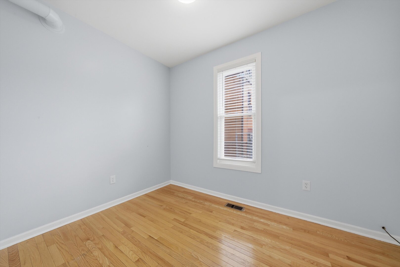 2125 West 18th Place, Unit 5 Chicago, IL 60608 - Photo 12 of 23 an empty room with a window