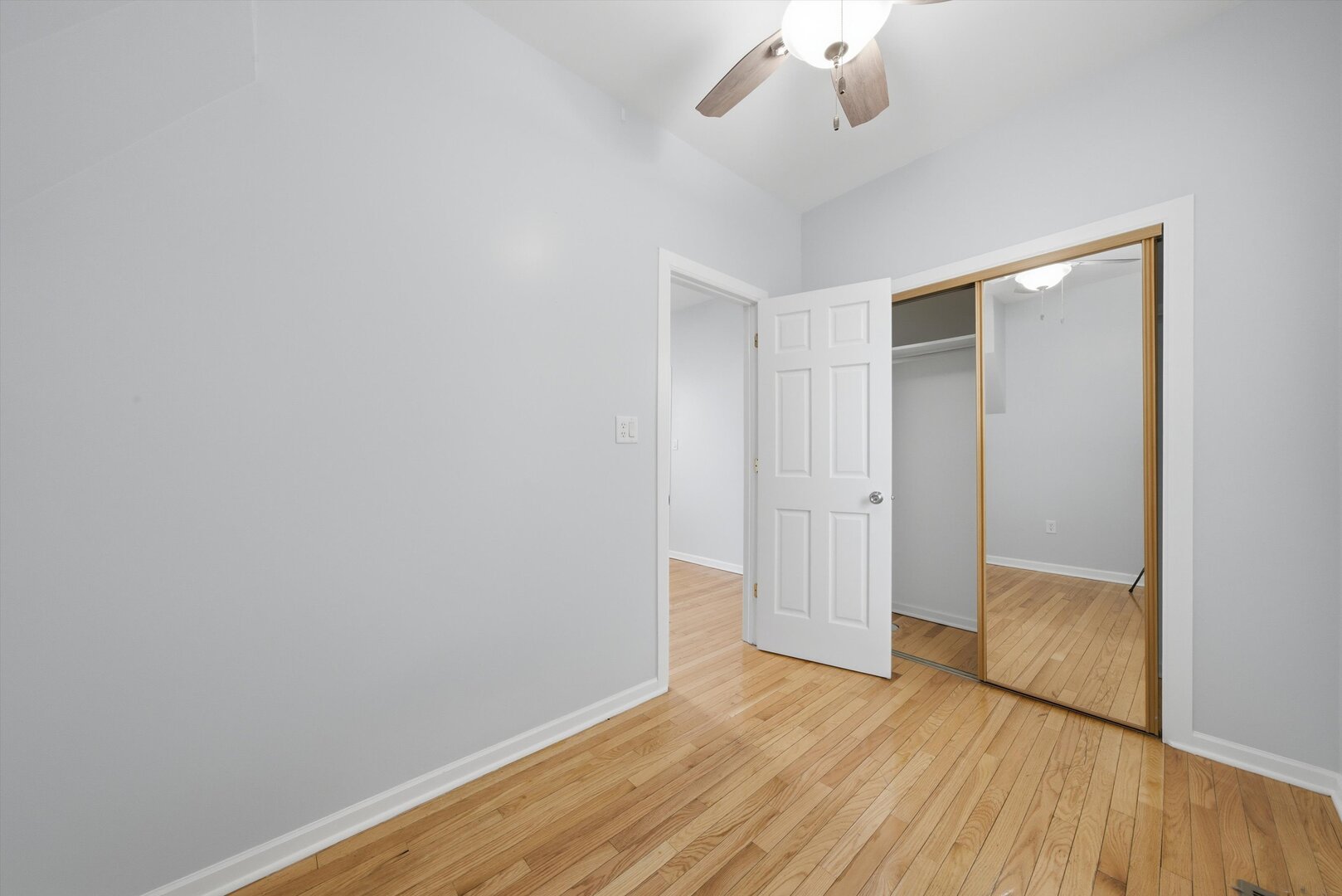 2125 West 18th Place, Unit 5 Chicago, IL 60608 - Photo 17 of 23 wooden floor in an empty room