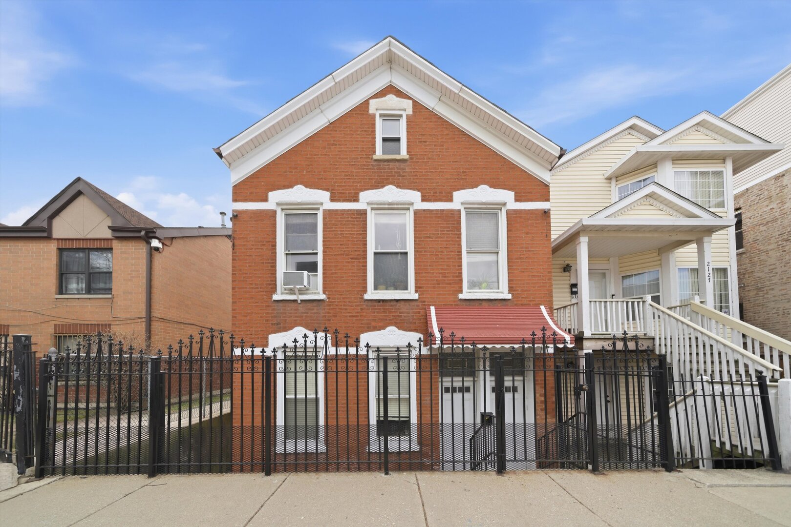 2125 West 18th Place, Unit 5 Chicago, IL 60608 - Photo 22 of 23 a front view of a house with a yard