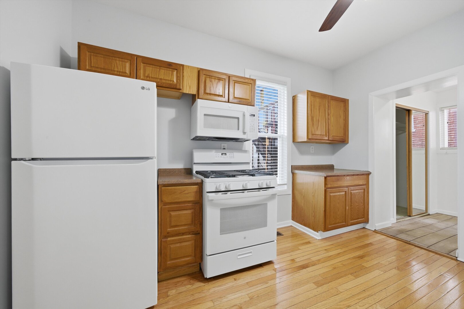 2125 West 18th Place, Unit 5 Chicago, IL 60608 - Photo 8 of 23 a kitchen with stainless steel appliances granite countertop a refrigerator and a stove top oven
