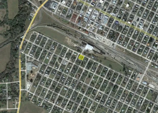 a view of a park with large trees