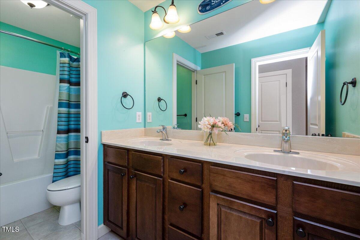 2117 Conroy Way Willow Spring, NC 27592 - Photo 28 of 38 Upstairs bathroom has a coastal flair