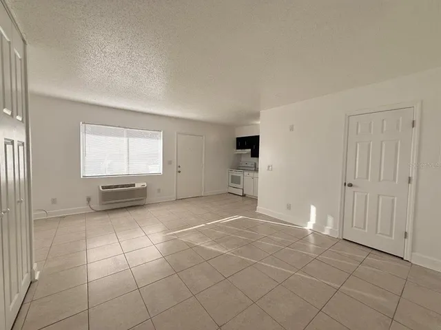 a view of a livingroom with a dinning table and chair