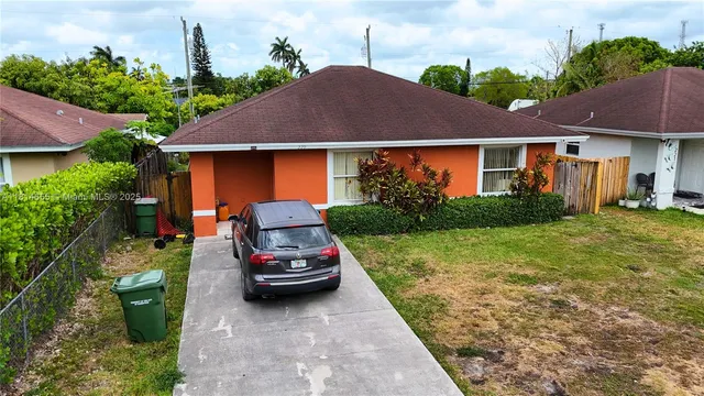 a house view with a garden space