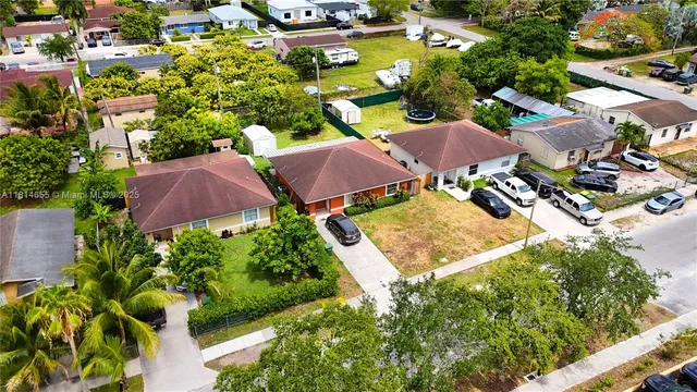 an aerial view of residential houses with outdoor space