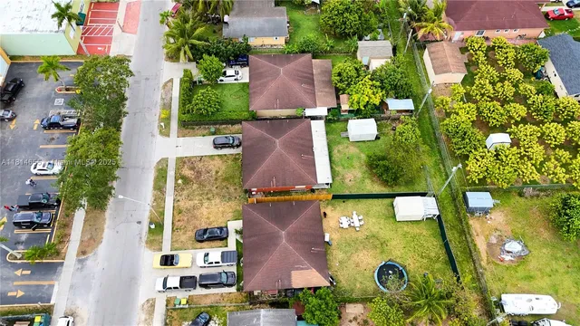 an aerial view of residential house with outdoor space and parking