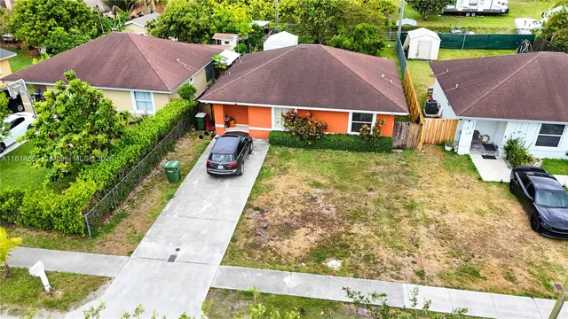 a view of house with garden space and street view