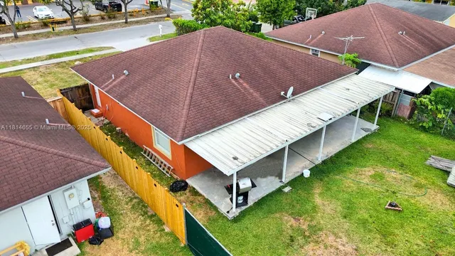 a aerial view of a house with a yard