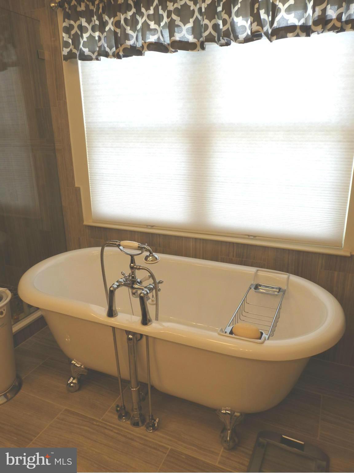 2236 Bear Den Road Frederick, MD 21701 - Photo 15 of 30 a white bath tub sitting next to a window