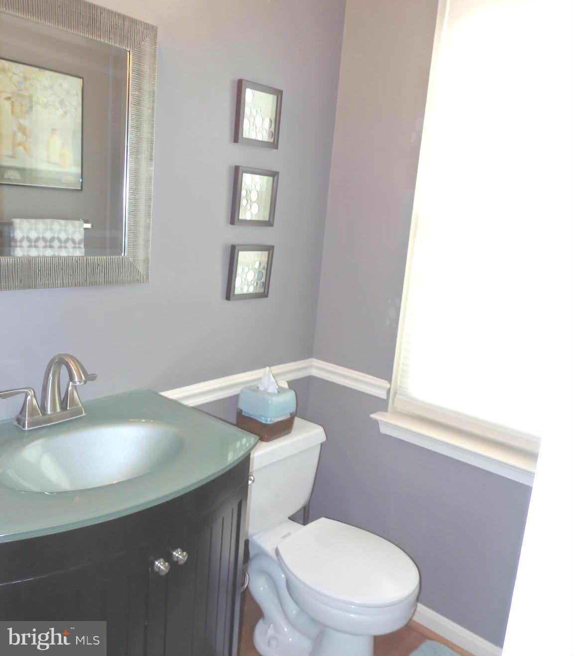 2236 Bear Den Road Frederick, MD 21701 - Photo 3 of 30 a white toilet sitting next to a bathroom sink
