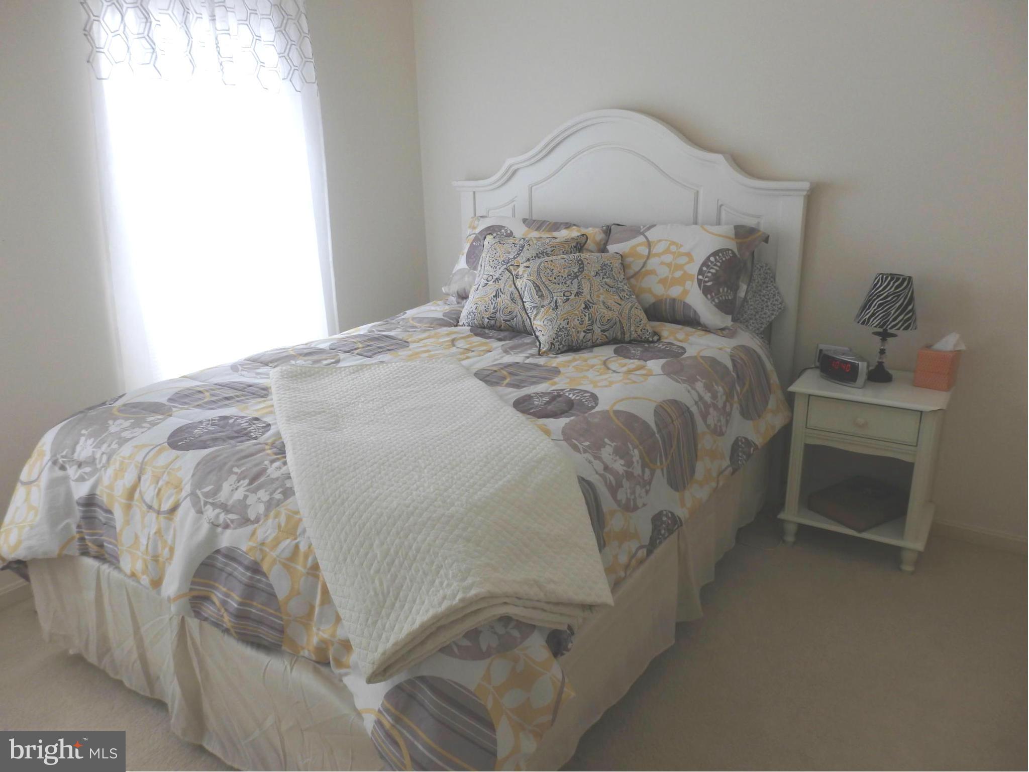 2236 Bear Den Road Frederick, MD 21701 - Photo 21 of 30 a bedroom with a bed and a window